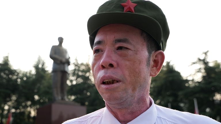 Zhang Xihua, a former military member who is dressed in a military-style uniform to pay respect to Chairman Mao