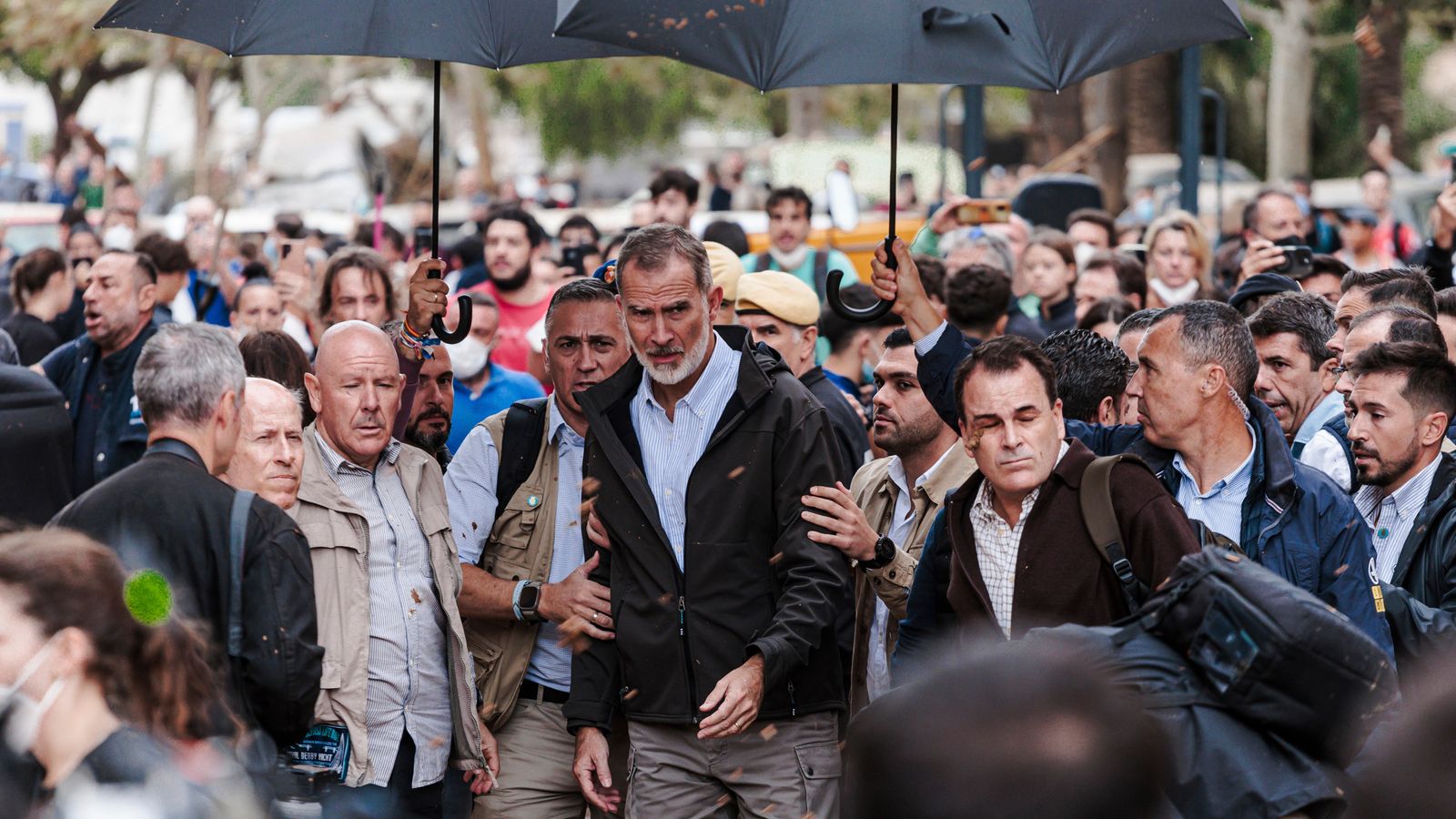 Angry crowds hurl mud and insults at King of Spain as he visits town devastated by floods