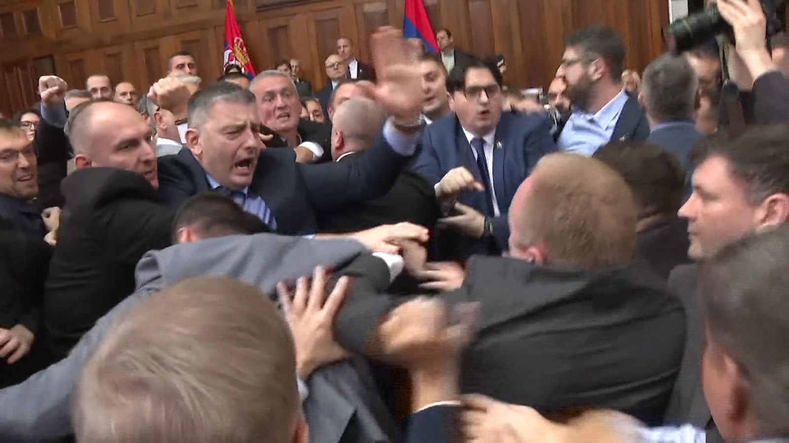 Fight breaks out in Serbian parliament between government and ...