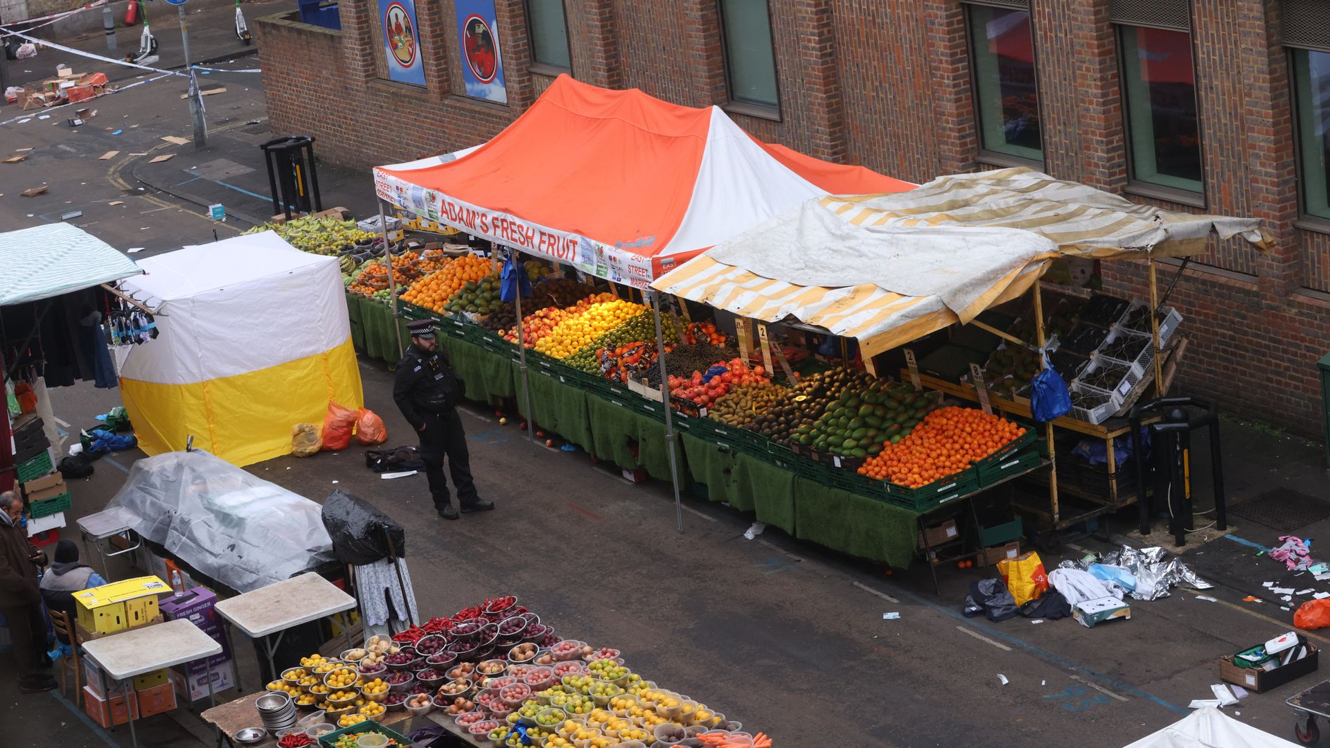 Man killed after three people stabbed at East Street Market in south London