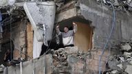 A man gestures as he stands in a damaged building in Beirut's southern suburbs, after a ceasefire between Israel and Hezbollah took effect, Lebanon November 27, 2024. REUTERS/Mohammed Yassin