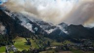 FILE - Smoke rises from a fire burning on the slopes of the mountains surrounding Nemocon, north of Bogota, Colombia, Jan. 23, 2024. (AP Photo/Ivan Valencia, File)