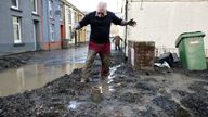 Resident Rob Scholes, 75, moves through mud at the site of a mudslide, in the aftermath of Storm Bert, in Cwmtillery, South Wales, Britain, November 25, 2024. REUTERS/Hollie Adams

