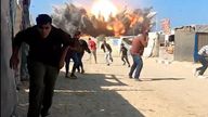 Palestinians flee an Israeli airstrike in northern Gaza