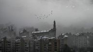 A flock of birds flies as smoke rises following Israeli airstrikes in Dahiyeh, Beirut, Lebanon, on Sunday.
Pic: AP/Hassan Ammar