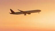 travel concept background, airplane in sunset sky, international flight