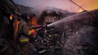 A firefighter at the site of a Russian drone strike in Mykolaiv in southern Ukraine. Pic: State Emergency Service of Ukraine/Reuters
