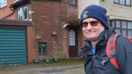 Roy with the abandoned home, which was eventually brought back into use