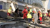 Rescue service workers at the scene of the roof collapse. Pic: AP
