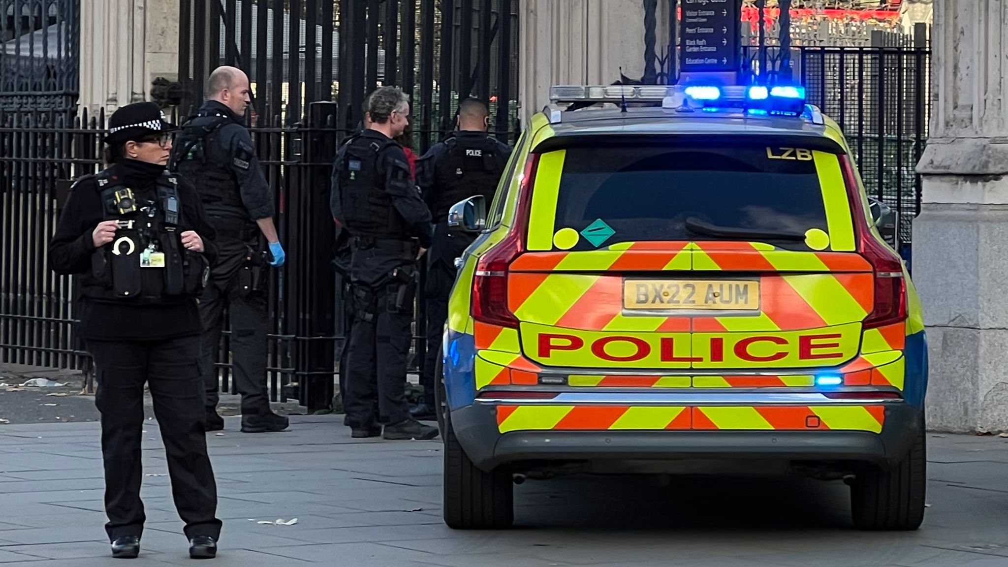 Man arrested after reports of person carrying knives outside Houses of ...