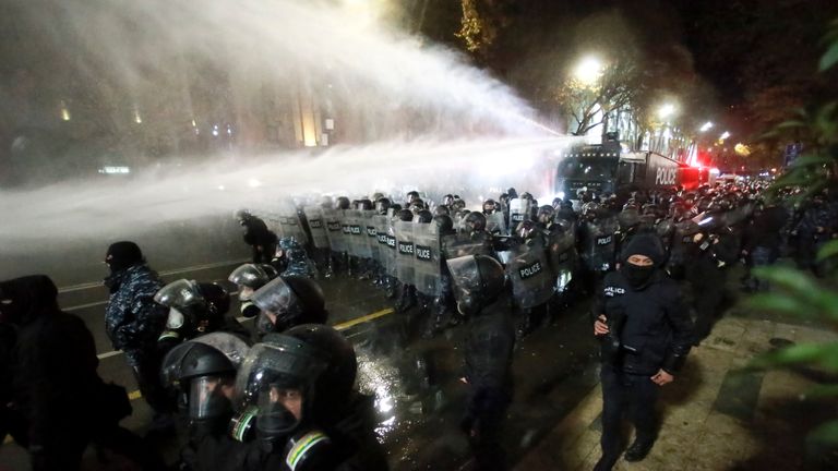 Police use a water cannon to prevent protesters pouring into the streets following Georgian Prime Minister Irakli Kobakhidze's announcement, rallying outside the parliament building in Tbilisi, Georgia, on Friday, Nov. 29, 2024. (AP Photo/Zurab Tsertsvadze)