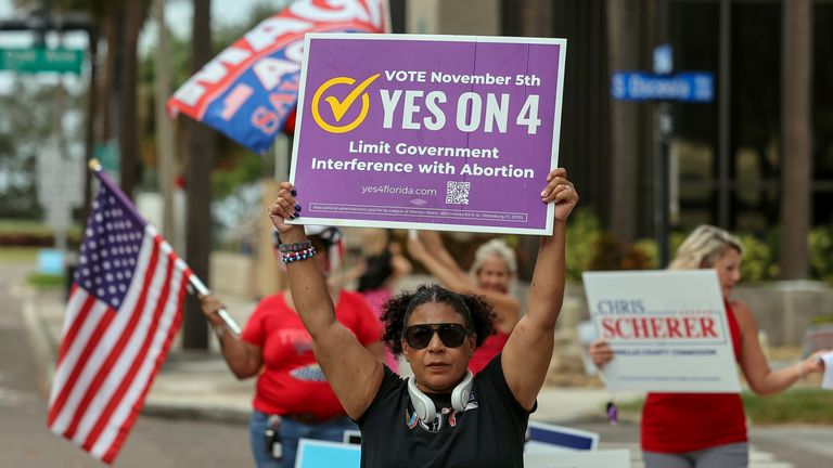 Beth Weinstein demonstrates in front of the polling station at the courthouse in support of Yes on Amendment 4 regarding abortion in Florida on Tuesday, November 5, 2024, in Clearwater, Florida. (AP Photo/Mike Carlson)