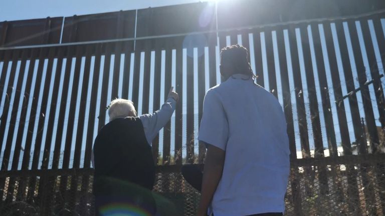 Shingi Mararike looks at the border wall between Arizona and Mexico