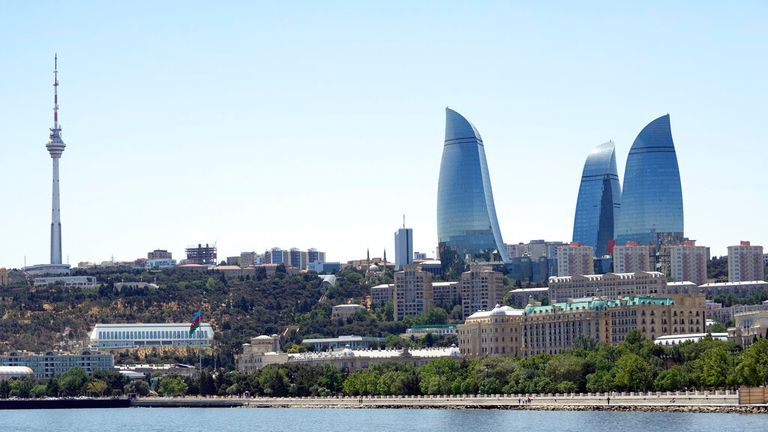 A general view of the Old City with the Flame Towers skyscrapers in background in Baku, Azerbaijan, Monday, June 7, 2021. (AP Photo/Darko Vojinovic)