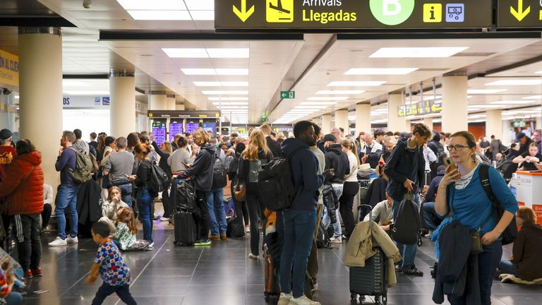 Several people at Barcelona-El Prat airport as flights are diverted due to the weather.
Pic: Europa Press/AP