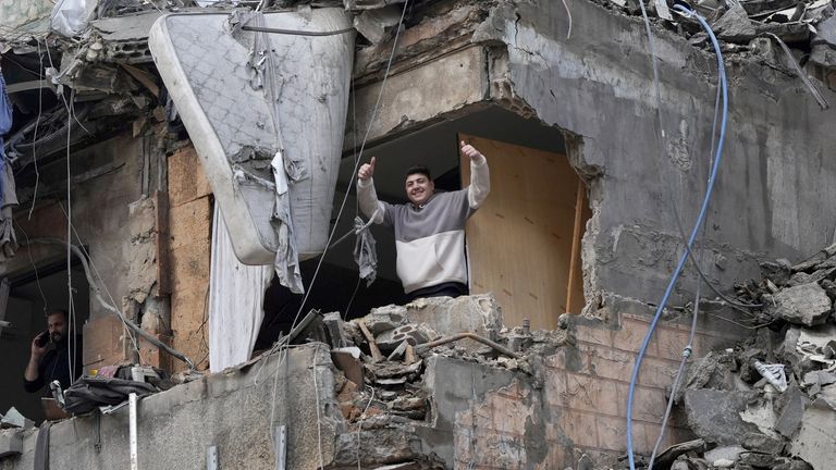 A man gestures as he stands in a damaged building in Beirut's southern suburbs, after a ceasefire between Israel and Hezbollah took effect, Lebanon November 27, 2024. REUTERS/Mohammed Yassin