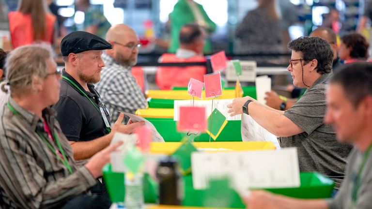 Election workers process mail-in ballots for the 2024 General Election in West Chester. Pic: AP