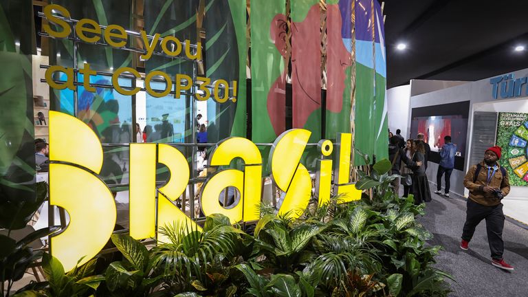 Participants gather next to a Brazil pavilion during the United Nations climate change conference COP29, in Baku, Azerbaijan November 18, 2024. REUTERS/Aziz Karimov