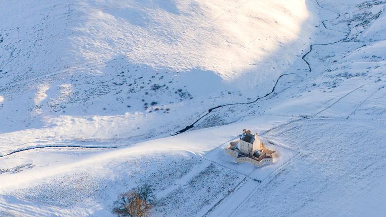 Corgarff Castle in Aberdeenshire, surrounded by snow on Friday. Storm Bert is battering the country with strong winds, heavy rain and snow and ice with amber warnings coming into force bringing a "potential risk to life and property". Picture date: Friday November 22, 2024.