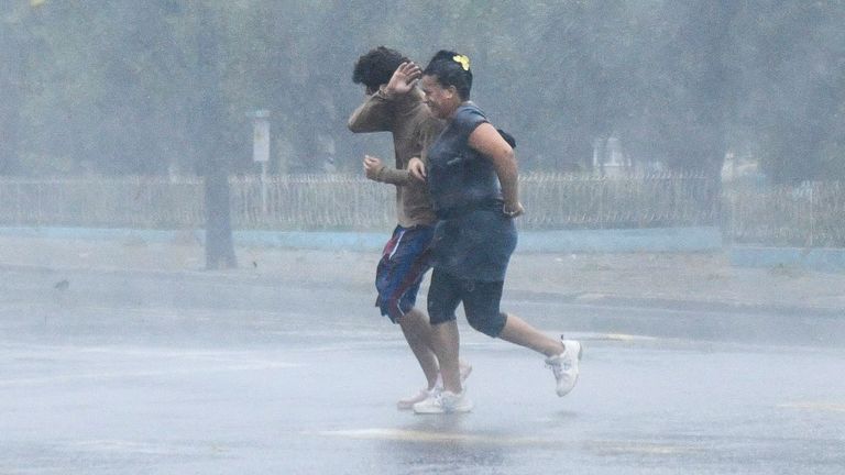 People tally  connected  the thoroughfare  arsenic  Hurricane Rafael passes by Havana, Cuba, November 6, 2024. REUTERS/Norlys Perez