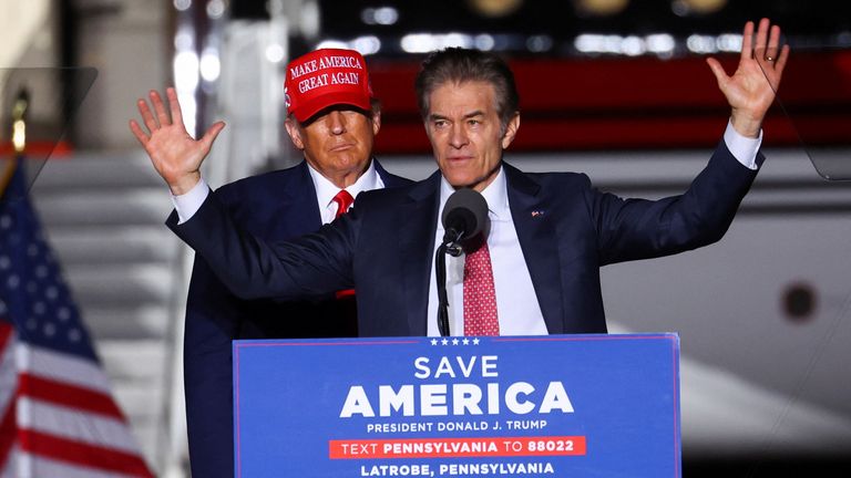 Donald Trump stands behind Dr Oz during rally in 2022