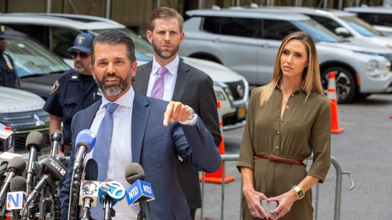 Donald Trump Jr. speaks to the news media, as Lara and Eric Trump stand nearby, across the street from former President Donald Trump's criminal trial in New York, Tuesday, May 28, 2024. Pic: AP