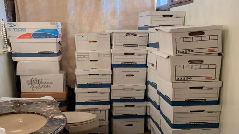 This image, contained in the indictment against former President Donald Trump, shows boxes of records stored in a bathroom and shower in the Lake Room at Trump's Mar-a-Lago estate in Palm Beach, Fla. The classified documents investigation of Donald Trump appeared to have clear momentum in 2022 when FBI agents who searched the former president...s Mar-a-Lago estate recovered dozens of boxes containing sensitive documents. But each passing day brings mounting doubts that the case can reach trial this year. The judge has yet to set a firm trial date despite holding two hours-long hearings with lawyers this month. (Justice Department via AP)