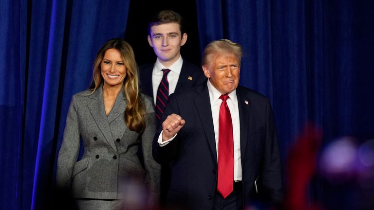 Donald Trump, Melania and Barron arrive at an election night watch party.
Pic: AP