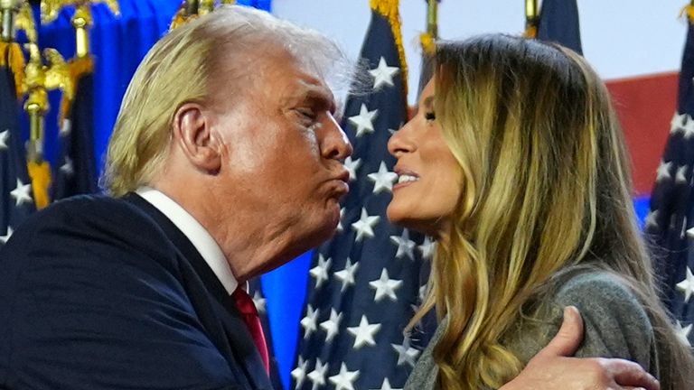 Republican presidential nominee former President Donald Trump kisses former first lady Melania Trump at an election night watch party at the Palm Beach Convention Center, Wednesday, Nov. 6, 2024, in West Palm Beach, Fla. (AP Photo/Evan Vucci)