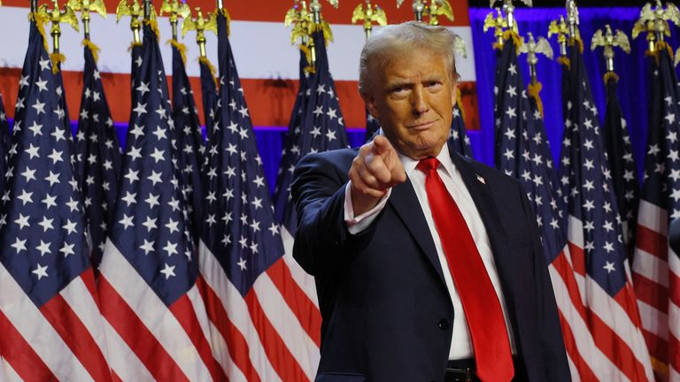 Republican presidential nominee and former U.S. President Donald Trump takes the stage to address supporters at his rally, at the Palm Beach County Convention Center in West Palm Beach, Florida, U.S., November 6, 2024. REUTERS/Brian Snyder