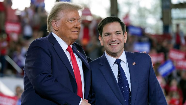 Donald Trump , left, with Marco Rubio, during a campaign rally in November. Pic: AP