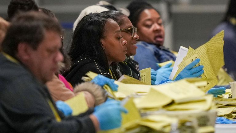 An election worker processes mail-in ballots in the Philadelphia election. Image: AP