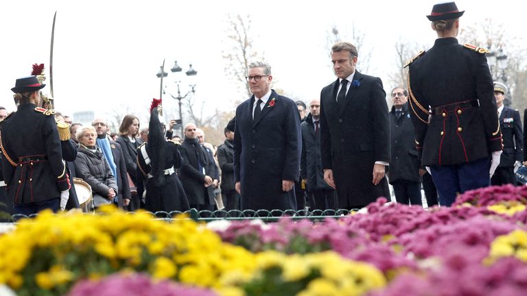 Emmanuel Macron and British Prime Minister Keir Starmer attend a wreath-laying ceremony in front of the statue of Georges Clemenceau on the Champs Elysees avenue, during commemorations marking the 106th anniversary of the WWI Armistice, in Paris, France, 11 November 2024. CHRISTOPHE PETIT TESSON/Pool via REUTERS