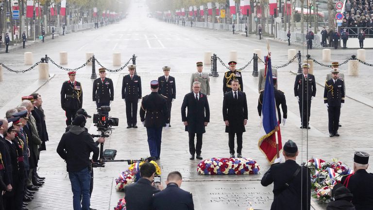 French President Emmanuel Macron, center right, and British Prime Minister Keir Starmer, center left, attend ceremonies marking the 106th anniversary of the Armistice, a celebration of their countries' friendship, as nations across the world pay tribute to their fallen soldiers in World War I,  Monday, Nov. 11, 2024 at the Arc de Triomphe in Paris,     Michel Euler/Pool via REUTERS