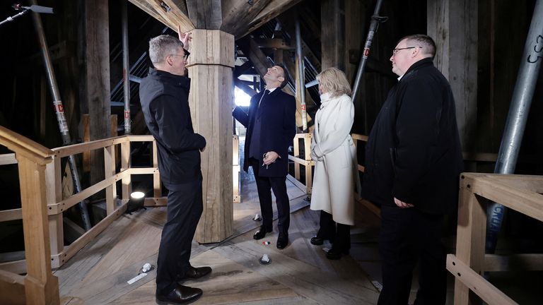 French President Emmanuel Macron and First Lady Brigitte Macron during a visit to Notre-Dame de Paris cathedral in Paris, France, 29 November 2024. French President Macron is visiting the cathedral's construction site on 29 November, to thank the donors and people who worked to rebuild the monument after it was severely damaged in a fire that broke out on 15 April 2019. The Paris Cathedral will be officially inaugurated after nearly six years of renovation work on 07 December 2024. CHRISTOPHE PE