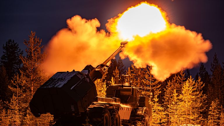 A muzzle flash lights up pine trees as the British Army&#39;s new Archer Mobile Howitzer gun fires, as British Army soldiers take part in training near Rovaniemi in the Arctic Circle, Finland. Picture date: Tuesday November 19, 2024.