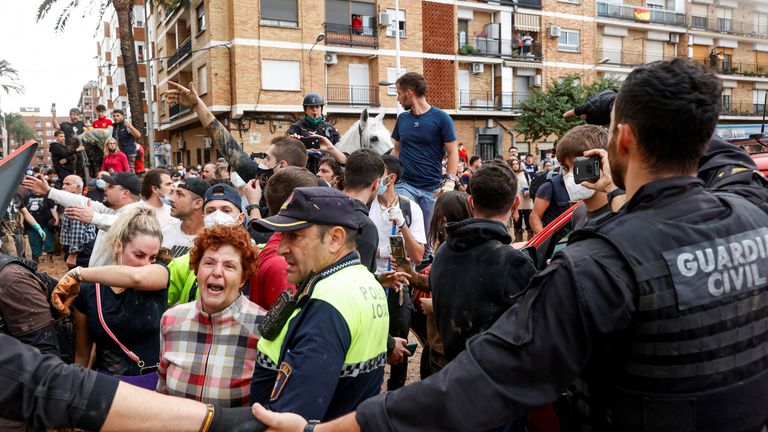 People protest as King Felipe visits Paiporta. Pic: Reuters