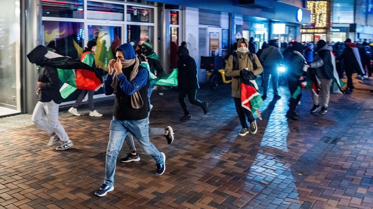 Pic:Jeroen Jumelet/EPA-EFE/Shutterstock

UEFA Europa League - Ajax vs Maccabi Tel Aviv, Amsterdam, Netherlands - 07 Nov 2024
Demonstrators run with Palestinian flags ahead of the UEFA Europa League match between Ajax and Maccabi Tel Aviv at Anton de Komplein in Amsterdam, Netherlands, 07 November 2024. Originally the demonstration was planned at the Johan Cruijff Arena, but that was banned by the municipality, as it was decided that the area is a security risk area.

7 Nov 2024