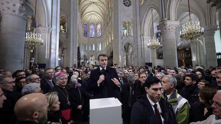 French President Emmanuel Macron delivers a speech inside Notre-Dame cathedral after visiting the restored interiors of the monument, Friday, Nov.29, 2024 in Paris. (Christophe Petit Tesson, Pool via AP)