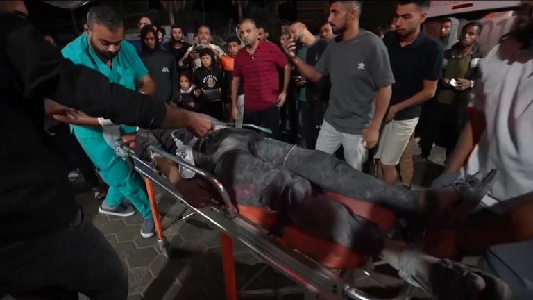 An injured man goes into a hospital in Gaza