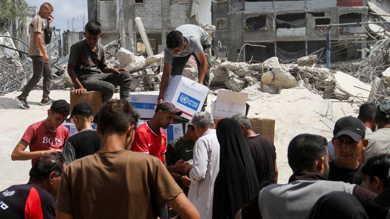 Palestinians gather to receive food in Jabalia in northern Gaza. Pic: Reuters