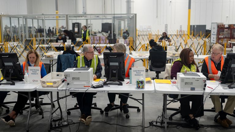 Fulton County officials count votes near Atlanta. Pic: Reuters