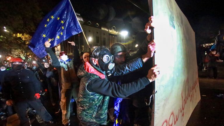 Protesters pouring into the streets of Georgia's capital. Pic: AP 