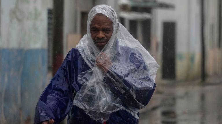 A antheral   walks done  the upwind   and rainfall  brought by Hurricane Rafael successful  Havana, Cuba, Wednesday, Nov. 6, 2024. (AP Photo/Ramon Espinosa)