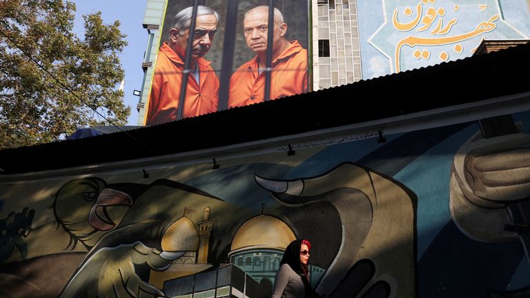 A billboard in Iran depicts Mr Netanyahu and Mr Gallant in prison jumpsuits.
Pic: Reuters