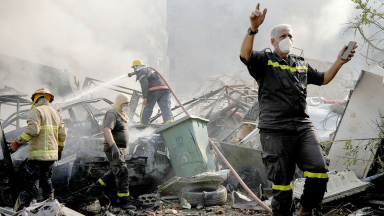 Civil defence members work at a site damaged in the aftermath of Israeli strikes on Beirut's southern suburbs, amid the ongoing hostilities between Hezbollah and Israeli forces, Lebanon, November 1, 2024. REUTERS/Mohammed Yassin