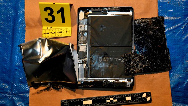 A smashed tablet recovered from bins near Teixeira's home.
Pic: AP