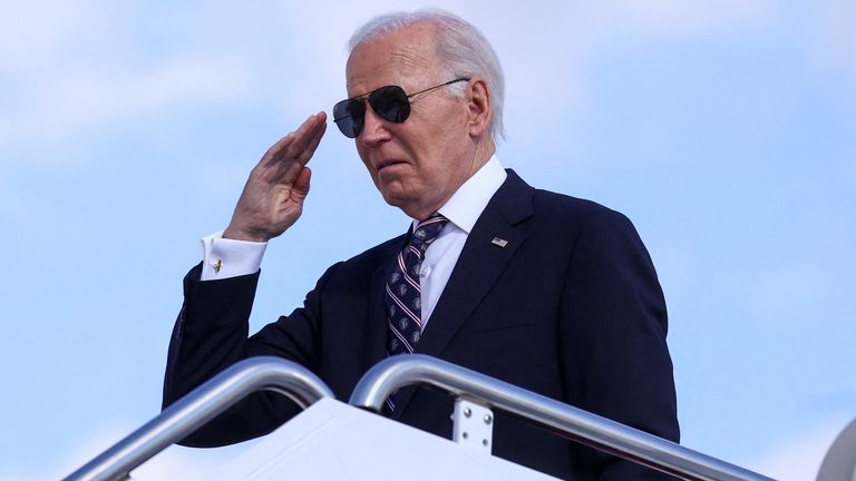 U.S. President Joe Biden salutes while boarding Air Force One as he departs for Wilmington, Delaware from Joint Base Andrews in Maryland, U.S., November 11, 2024. REUTERS/Hannah McKay