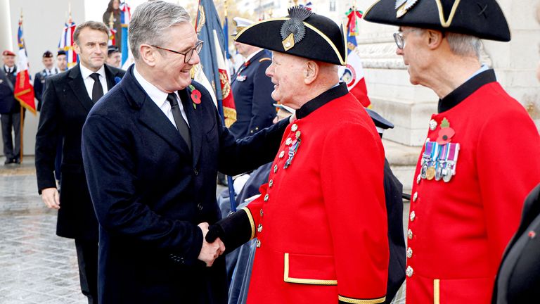 Keir Starmer greets Chelsea Pensioners on the Place de l'Etoile during the commemorations marking the 106th anniversary of the November 11, 1918, Armistice.
Pic: Reuters