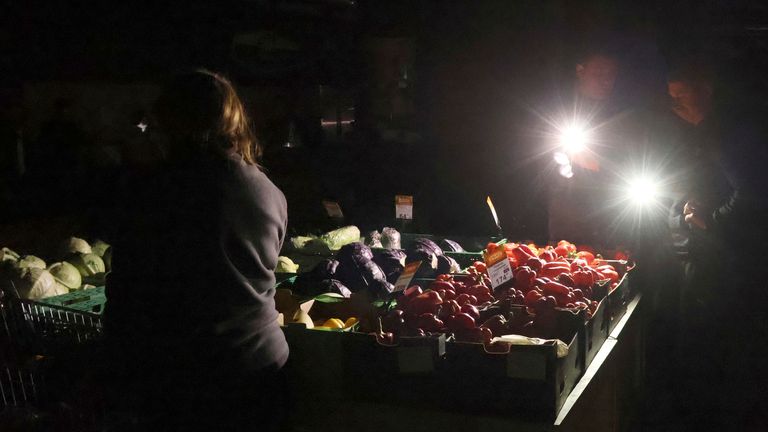 A supermarket in Kyiv during a power outage. Pic: AP